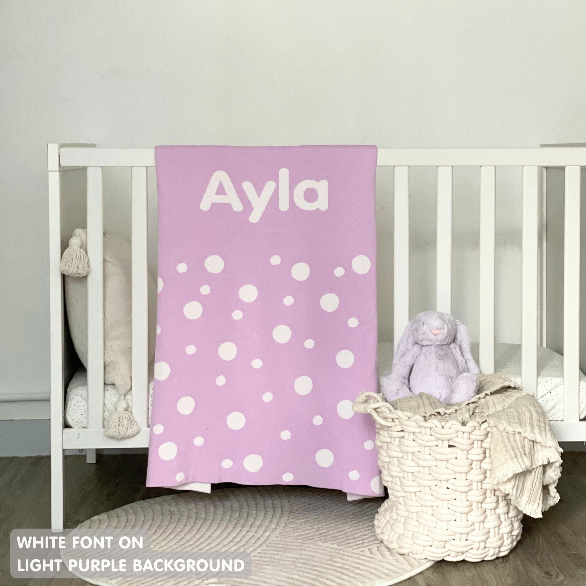 Knitted baby blanket in light purple and white with a dot pattern, customised with baby's name, made by TinyBitz