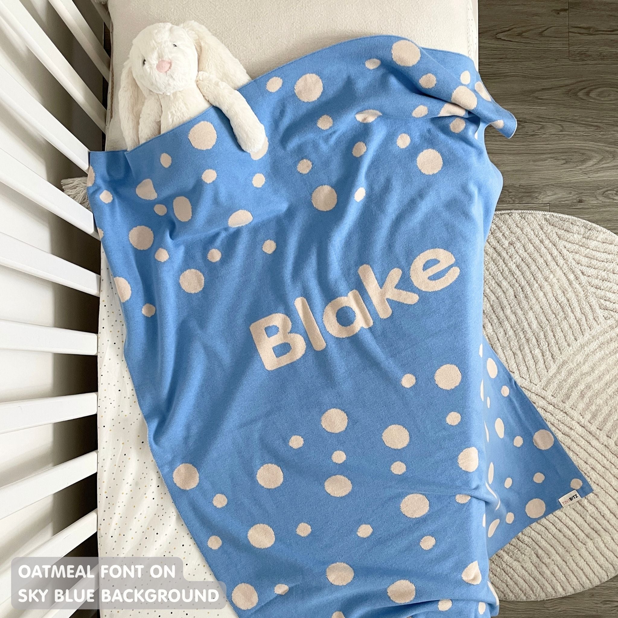 TinyBitz personalized baby name blanket, knitted in sky blue and oatmeal with a dot pattern, perfect baby shower gift!
