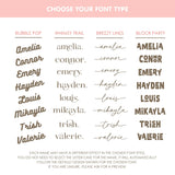 Font options for name personalization on the blanket. TinyBitz knitted baby blanket in navy background with a confetti pattern.