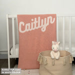 TinyBitz custom knitted blanket with baby's name on pink background with a confetti pattern, best gift to welcome a newborn baby.