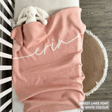 Knitted baby blanket in pink and white with a confetti pattern, customised with baby's name, made by TinyBitz.