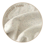 Knitted baby blanket in cream with a confetti pattern, customised with baby's name, made by TinyBitz.
