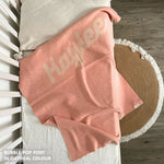 TinyBitz knitted name blanket in pink and oatmeal with a confetti pattern, a lovely touch to decorate your baby's room!