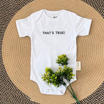 Personalised baby onesie with quote “That's True!” in white — custom newborn gift by TinyBitz