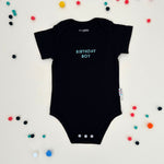 Organic cotton baby onesie with quote “Birthday Boy”, ideal for baby shower gifts and keepsakes by TinyBitz.