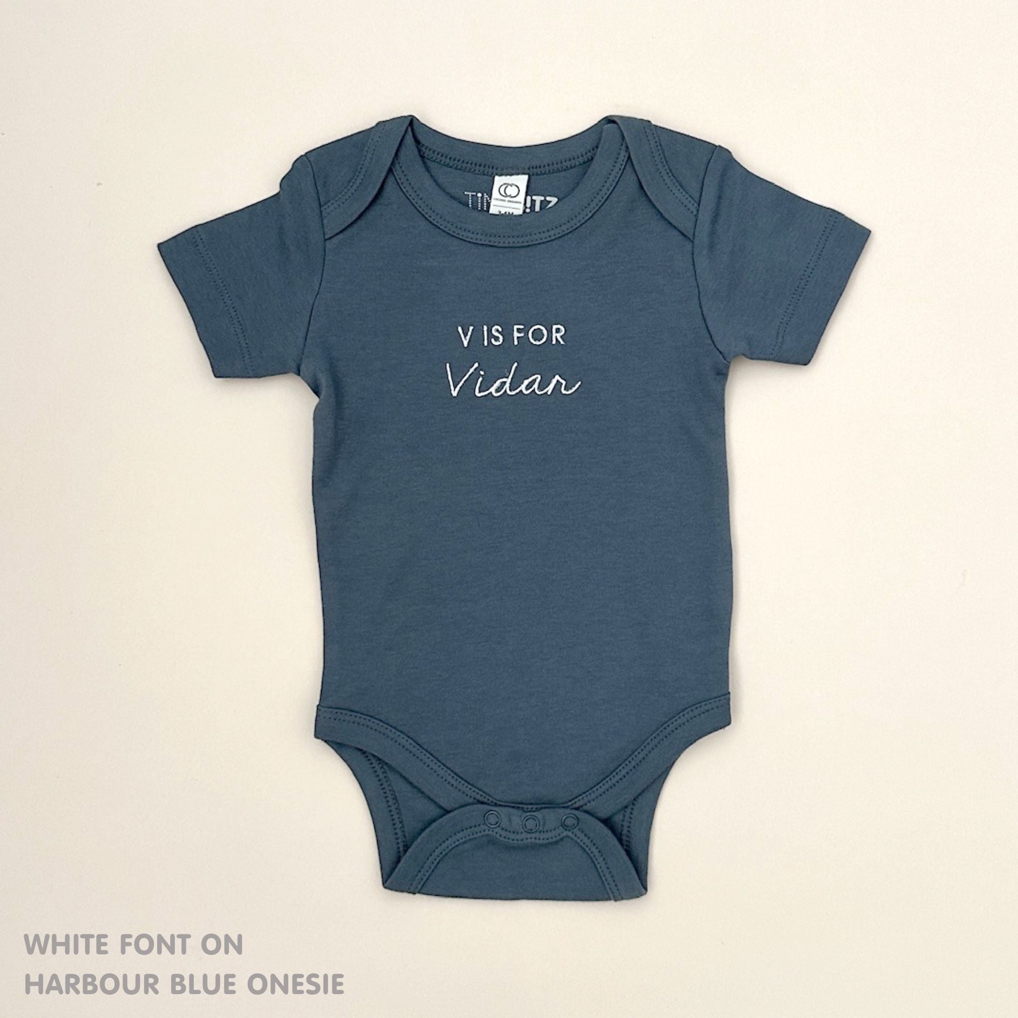 Organic cotton harbour blue onesie for babies with embroidered name, personalized baby shower gift keepsake from TinyBitz.