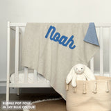 TinyBitz personalized name blanket in cream and sky blue with a confetti pattern, perfect gift for newborn babies and kids.