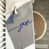 Knitted baby blanket in grey and blue with a confetti pattern, customised with baby's name, made by TinyBitz.