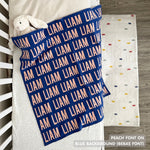 TinyBitz knitted name blanket in blue and peach can be used to decorate your baby's room!