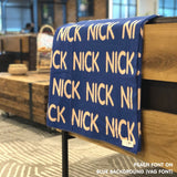Custom name blanket in blue and peach draped over a chair makes the best personalized home decor.