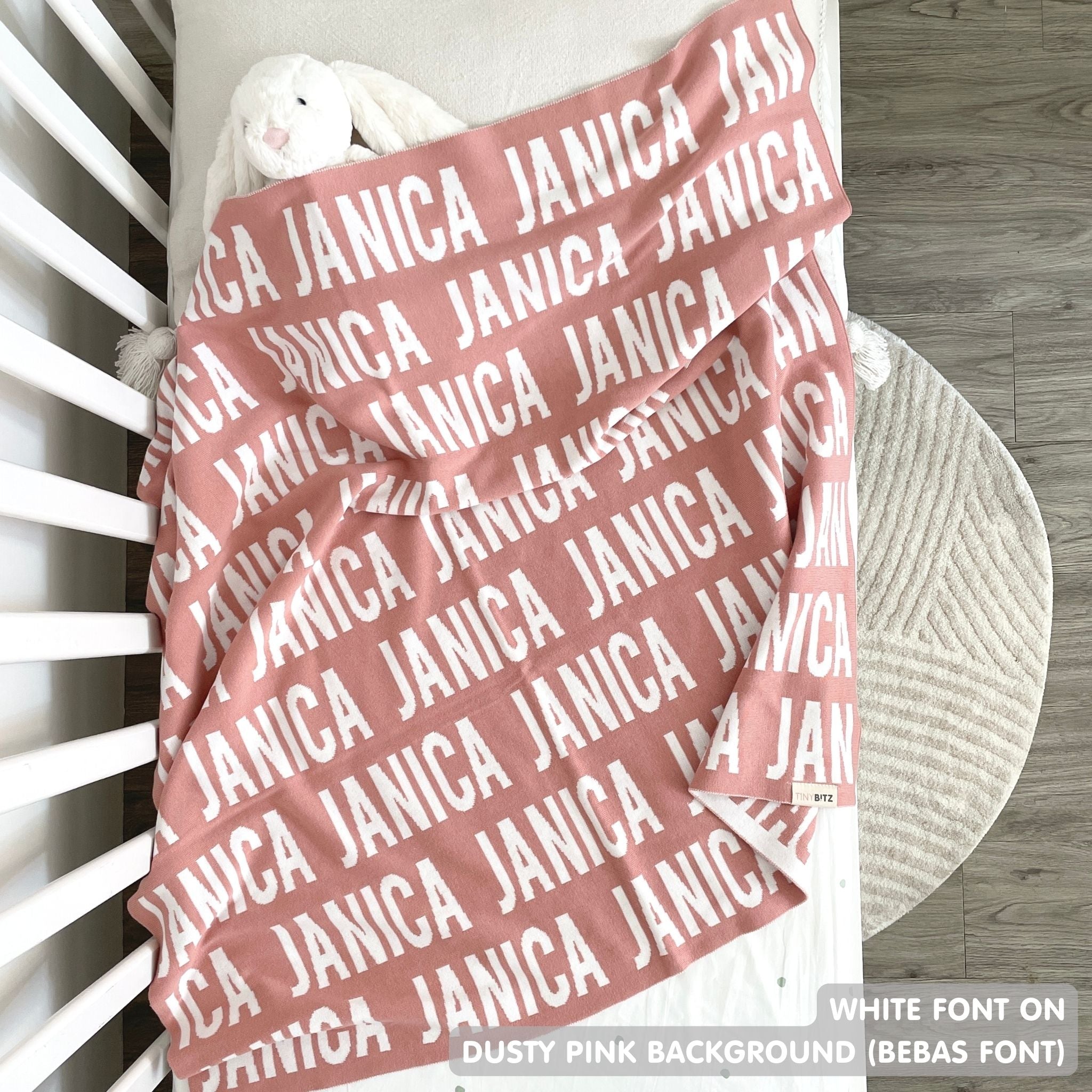 TinyBitz Personalized blanket for baby girls knitted from cotton in dusty pink and white.