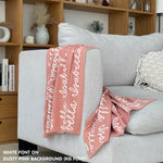 Customisable sofa throw and blanket with your own name knitted in dusty pink and white, made by TinyBitz!