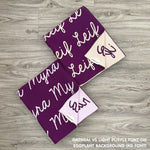 Cotton baby blanket with baby's name knitted in eggplant background, made by TinyBitz.