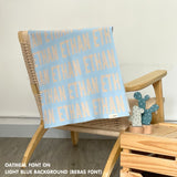 TinyBitz knitted cotton blanket in light blue and oatmeal, personalised with your own name!