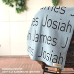 Knitted baby blanket in light blue and charcoal, customised with baby's name, made by TinyBitz.