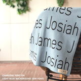 Knitted baby blanket in light blue and charcoal, customised with baby's name, made by TinyBitz.