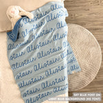TinyBitz knitted baby boys blanket in light blue background and sky blue, personalized with your baby’s name.