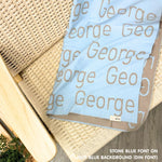 TinyBitz knitted name blanket in light blue and stone can be used to decorate your baby's room!