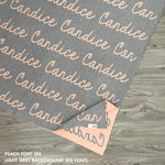 TinyBitz knitted cotton blanket in light grey and peach, personalised with your own name!