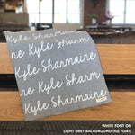 Personalized blanket with couple's name knitted in light grey and white, made by TinyBitz.
