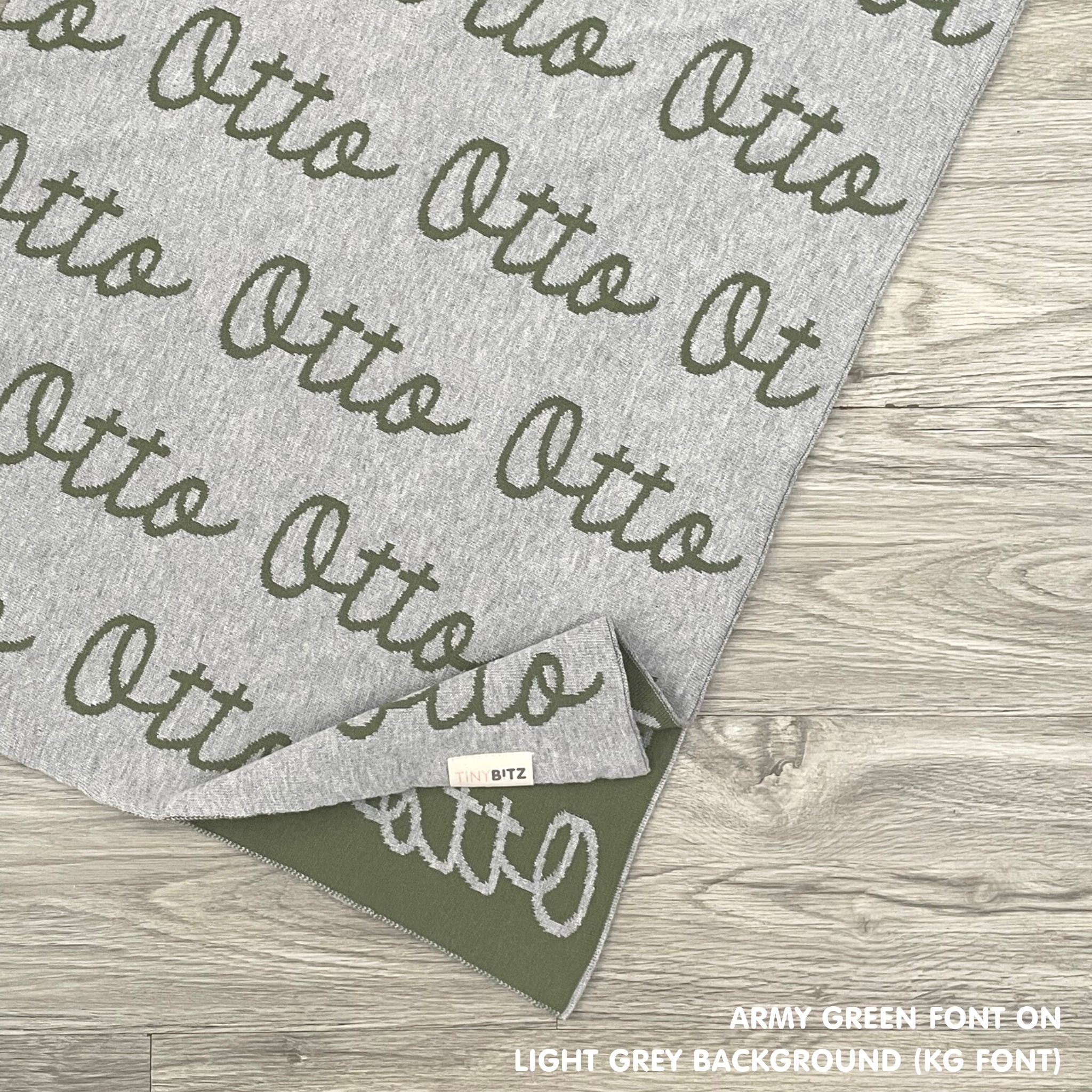 TinyBitz Personalized baby knitted name blanket in light grey and army green, making the best baby shower gift!