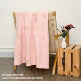 Personalized blanket with couple's name knitted in light pink and oatmeal, made by TinyBitz.