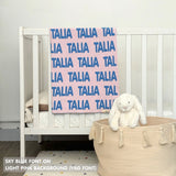 TinyBitz knitted baby girls blanket in light pink background and sky blue, personalized with your baby’s name.