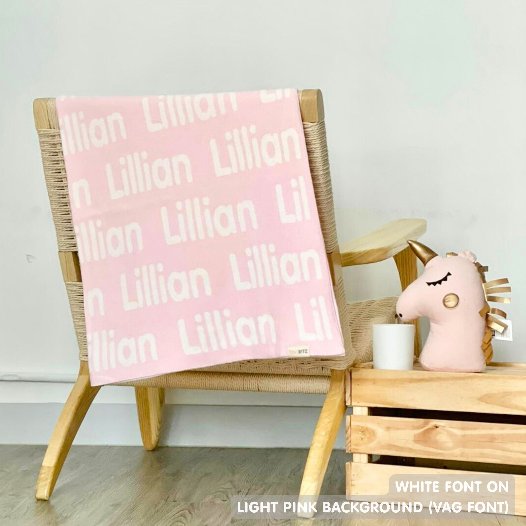 TinyBitz knitted name blanket in light pink and white can be used to decorate your baby's room!