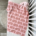 Cotton baby blanket with baby's name knitted in light pink and dusty pink, made by TinyBitz.
