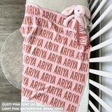 Cotton baby blanket with baby's name knitted in light pink and dusty pink, made by TinyBitz.