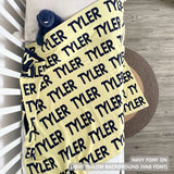 TinyBitz Personalized blanket for baby boy knitted from cotton in light yellow and navy.