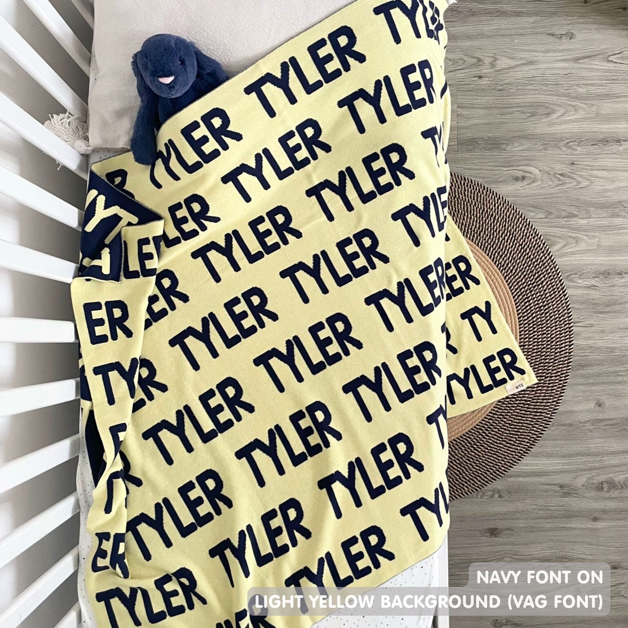 TinyBitz Personalized blanket for baby boy knitted from cotton in light yellow and navy.