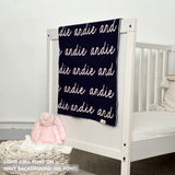 TinyBitz knitted baby girls blanket in navy background and light pink, personalized with your baby’s name.