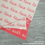 Customisable sofa throw and blanket with your own name knitted in oatmeal and charcoal, made by TinyBitz!