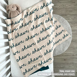 TinyBitz knitted name blanket in oatmeal and teal can be used to decorate your baby's room!