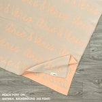 TinyBitz custom name blanket with couple's name knitted in oatmeal and peach, making the perfect wedding or anniversary gift!