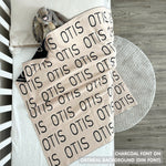 TinyBitz Personalized baby knitted name blanket in oatmeal and charcoal, making the best baby shower gift!