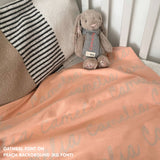TinyBitz Personalized blanket for baby girls knitted from cotton in peach and oatmeal.