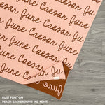 TinyBitz custom name blanket with couple's name knitted in peach and rust, making the perfect wedding or anniversary gift!