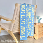 Personalised blanket for adult knitted from cotton in sky blue and light yellow, custom made by TinyBitz.