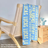 Personalised blanket for adult knitted from cotton in sky blue and light yellow, custom made by TinyBitz.