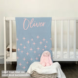 TinyBitz personalized baby name blanket, knitted in light blue and light pink with a twinkles pattern, perfect baby shower gift!