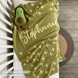 TinyBitz custom knitted blanket with baby's name on sage background with a twinkles pattern, best gift to welcome a newborn baby.
