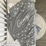 Knitted baby blanket in light grey and white with a twinkles pattern, customised with baby's name, made by TinyBitz.