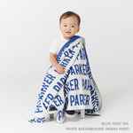 TinyBitz personalized knitted blanket in white background, customized with baby's name and made from 100% cotton.