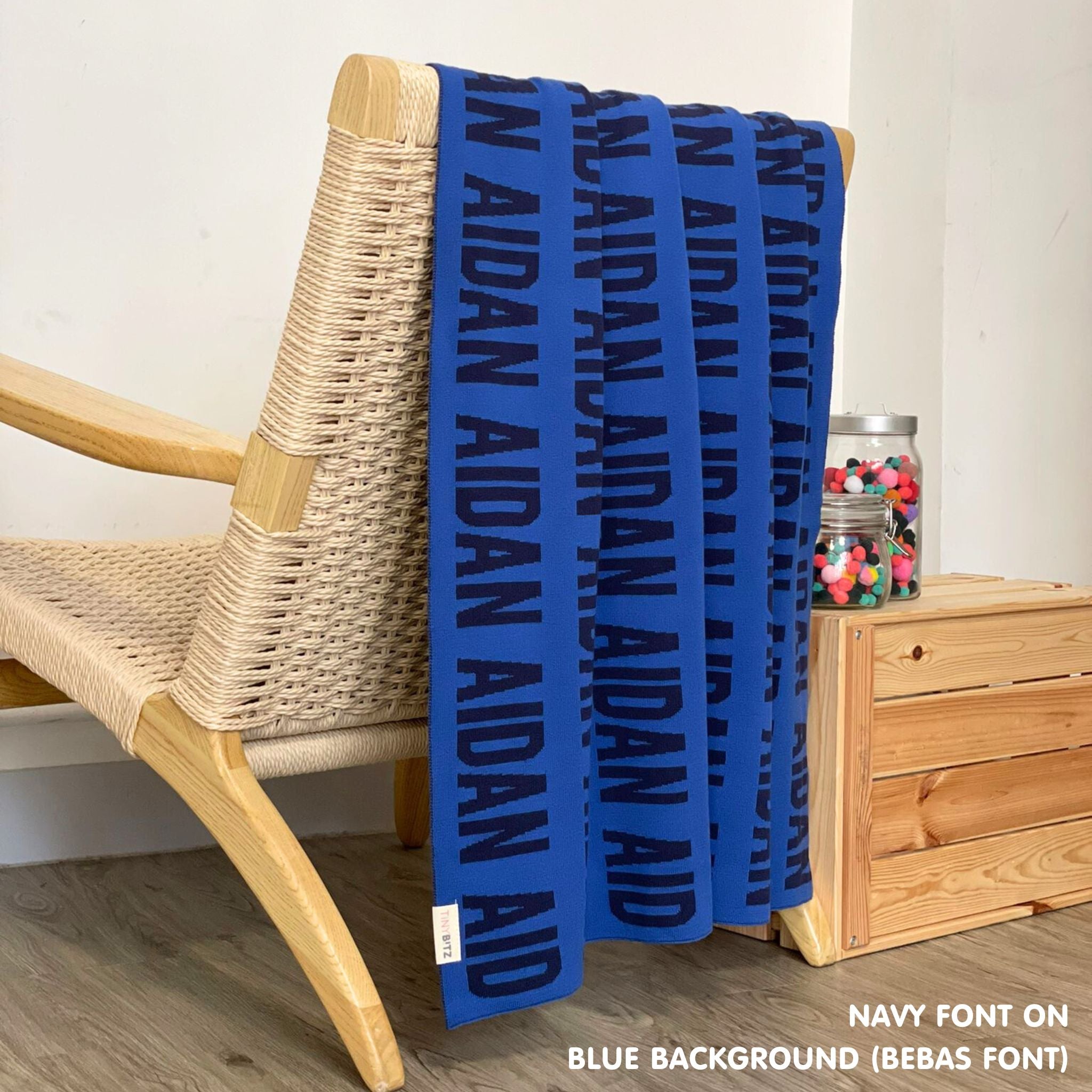 Custom cotton blanket for boys in blue and navy, personalized by TinyBitz.
