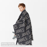 TinyBitz Personalized kids knitted name blanket in charcoal and oatmeal, perfect as a birthday gifts for kids!