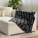 TinyBitz Kids Blanket in charcoal and oatmeal, personalized with child's name and made from 100% cotton.