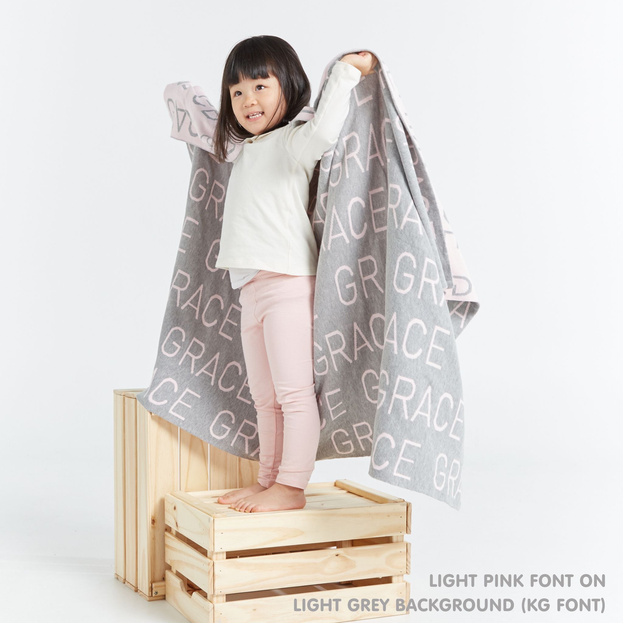 TinyBitz Kids Blanket in light grey and light pink, personalized with child's name and made from 100% cotton.