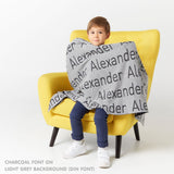 TinyBitz Personalized kids knitted name blanket in light grey and charcoal, perfect as a birthday gifts for kids!
